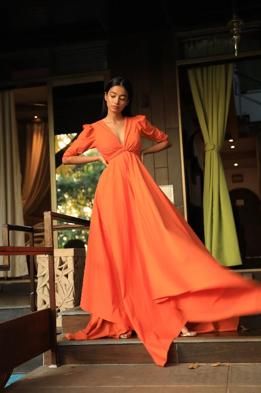 Orange dress with a plunging draped neckline and cut out back Date night unclassified dresses